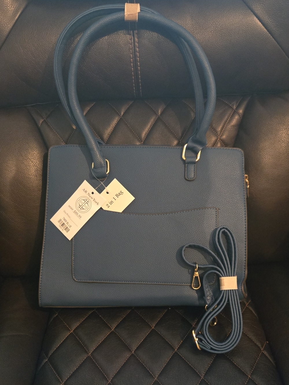 2-in-1 Blue Structured Tote Bag With Cross body strap and cosmetic bag inside.